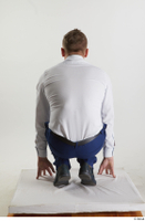  Steve Q  1 black oxford shoes blue trousers business dressed kneeling white shirt whole body 0005.jpg